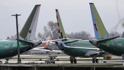 ﻿FILE- In this Nov. 14, 2018, file photo Boeing 737 MAX 8 planes are parked near Boeing Co.'s 737 assembly facility in Renton, Wash. Investigators were rushing to the scene of a devastating plane crash in Ethiopia on Sunday, March 10, 2019, an accident that could renew safety questions about the newest version of Boeing's popular 737 airliner. (AP Photo/Ted S. Warren, File)