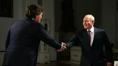 HANDOUT - 09 February 2024, Russia, Moscow: Russian President Vladimir Putin shakes hands with US journalist Tucker Carlson during an interview. Photo: -/Kremilin Pool/dpa - ATTENTION: editorial use only and only if the credit mentioned above is referenced in full