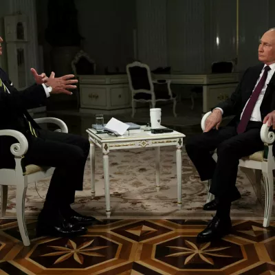 Russian President Vladimir Putin listens during an interview with U.S. television host Tucker Carlson in Moscow, Russia February 6, 2024. Sputnik/Gavriil Grigorov/Kremlin via REUTERS ATTENTION EDITORS - THIS IMAGE WAS PROVIDED BY A THIRD PARTY.