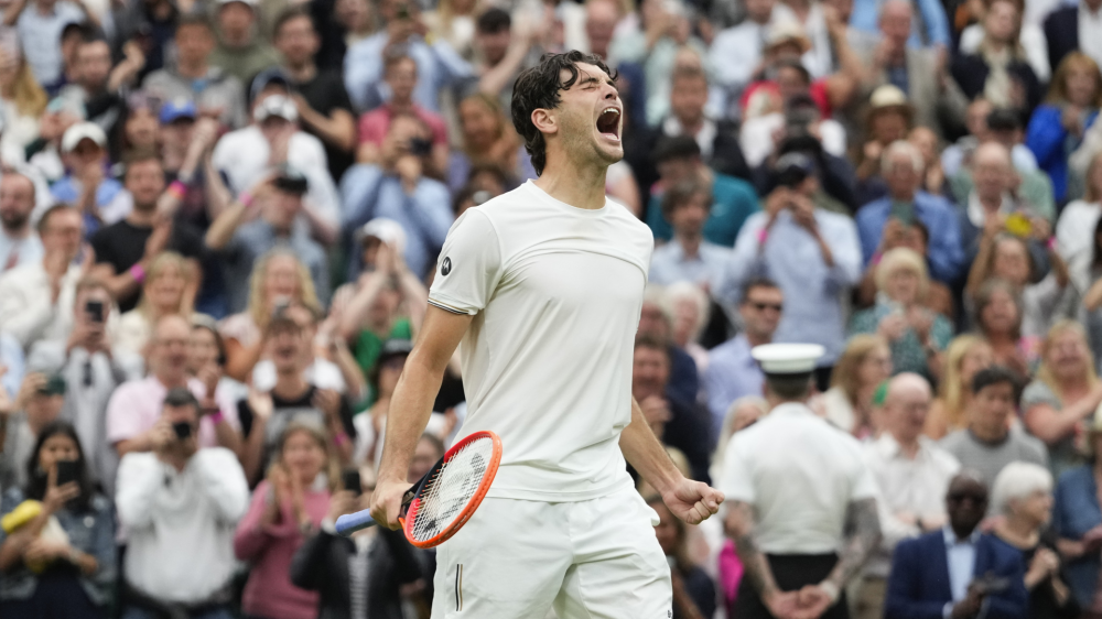 Taylor Fritz of the United States celebrates after defeating Alexander Zverev of Germany in their fourth round match at the Wimbledon tennis championships in London, Monday, July 8, 2024. (AP Photo/Kirsty Wigglesworth)