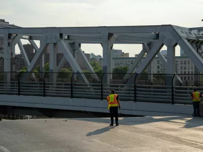 The Fire Department of New York (FDNY) and bridge maintenance workers attempt to cool off the 3rd avenue Bridge after it was stuck in the boat passage position after experiencing overheating, in the Bronx Borough of New York City, U.S., July 8, 2024.REUTERS/David 'Dee' Delgado