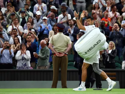 Tennis - Wimbledon - All England Lawn Tennis and Croquet Club, London, Britain - July 8, 2024 Serbia's Novak Djokovic applauds the crowds as he walks off the court after winning his fourth round match against Denmark's Holger Rune REUTERS/Paul Childs