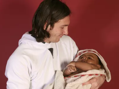 This photo taken in Sept. 2007 shows a 20-year-old Lionel Messi, who had embarked on his legendary Barcelona career just over four years prior, cradling Lamine Yamal, who was merely six months old at the time during a photo session in the dressing room of the Camp Nou stadium in Barcelona, Spain. Lamine Yamal is now a soccer sensation for both Spain and Barcelona and he is still only 16-years-old. (AP Photo/Joan Monfort)