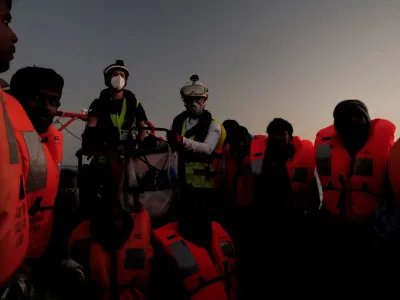 Migrants are rescued by crew members of NGO rescue ship 'Ocean Viking' in the Mediterranean Sea, October 26, 2022. Camille Martin Juan/Sos Mediterranee/Handout via REUTERS ATTENTION EDITORS THIS IMAGE HAS BEEN SUPPLIED BY A THIRD PARTY. NO RESALES. NO ARCHIVES