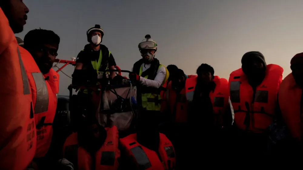 Migrants are rescued by crew members of NGO rescue ship 'Ocean Viking' in the Mediterranean Sea, October 26, 2022. Camille Martin Juan/Sos Mediterranee/Handout via REUTERS ATTENTION EDITORS THIS IMAGE HAS BEEN SUPPLIED BY A THIRD PARTY. NO RESALES. NO ARCHIVES