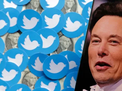 FILE PHOTO: Elon Musk photo, Twitter logos and U.S. dollar banknotes are seen in this illustration, August 10, 2022. REUTERS/Dado Ruvic/Illustration/File Photo