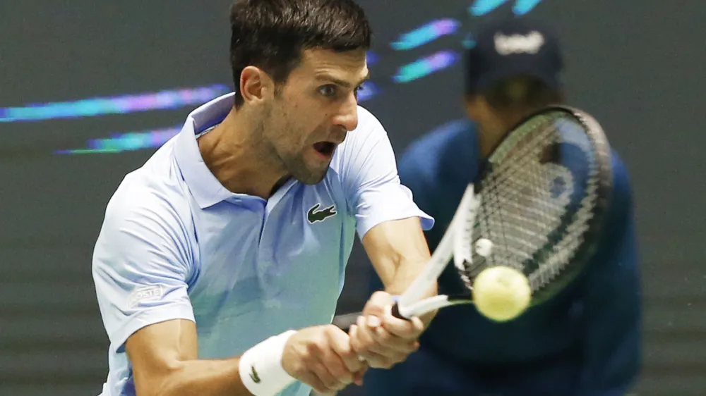 Serbia's Novak Djokovic returns the ball to Stefanos Tsitsipas of Greece during their ATP 500 Astana Open tennis tournament final match in Astana, Kazakhstan, Sunday, Oct. 9, 2022. (AP Photo/Stas Filippov)