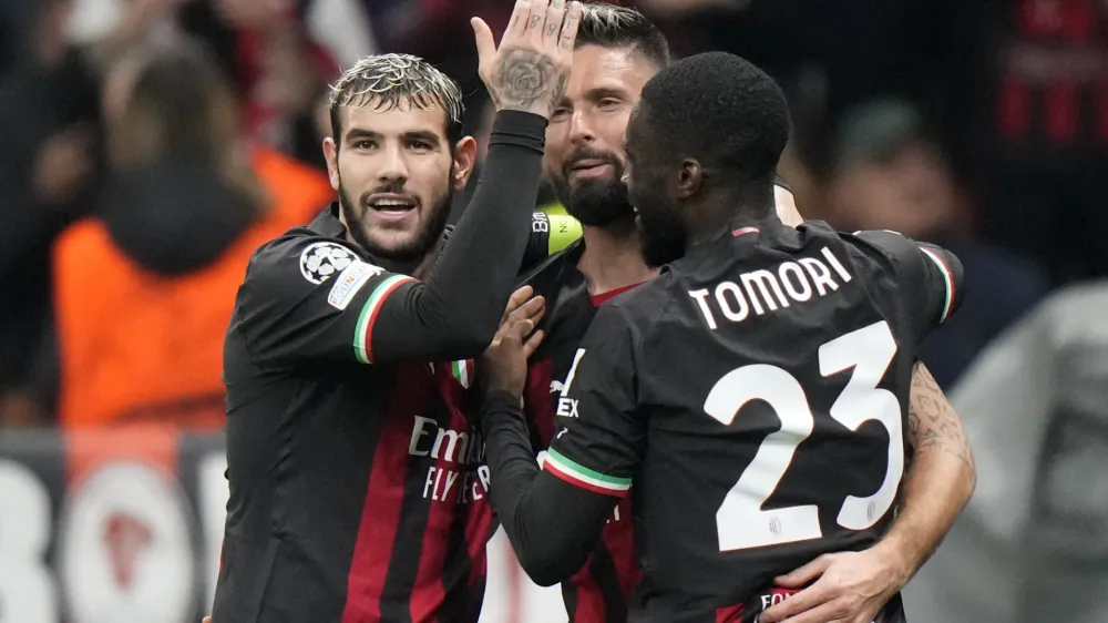 AC Milan's Olivier Giroud, center, celebrates with teammates after scoring his side's third goal during the Champions League, Group E soccer match between AC Milan and FC Salzburg, at the San Siro stadium in Milan, Italy, Wednesday, Nov. 2, 2022. (AP Photo/Luca Bruno)