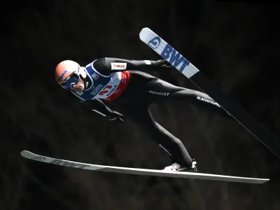 Poland's Dawid Kubacki competes during the FIS Men's HS134 qualification at the Ski Jumping World Cup in Wisla, Poland, Friday, Nov. 4, 2022. (AP Photo/ Adam Nurkiewicz)