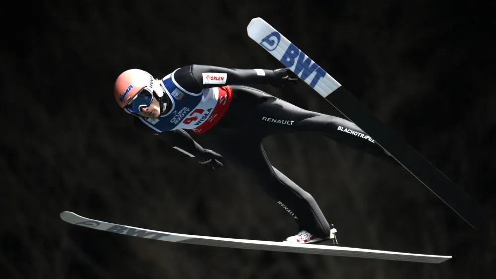 Poland's Dawid Kubacki competes during the FIS Men's HS134 qualification at the Ski Jumping World Cup in Wisla, Poland, Friday, Nov. 4, 2022. (AP Photo/ Adam Nurkiewicz)