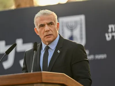 HANDOUT - 06 November 2022, Israel, Jerusalem: Israeli Prime Minister Yair Lapid speaks at the state memorial ceremony for former Prime Minister of Israel Yitzhak Rabin and his wife Leah Rabin at Mt. Herzl. Photo: Kobi Gideon/GPO/dpa - ATTENTION: editorial use only and only if the credit mentioned above is referenced in full