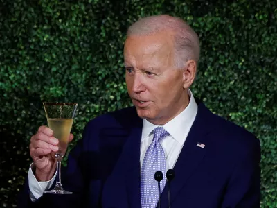 U.S. President Joe Biden makes a toast during a dinner for NATO allies and partners at the White House during NATO's 75th anniversary summit in Washington, U.S., July 10, 2024. REUTERS/Evelyn Hockstein