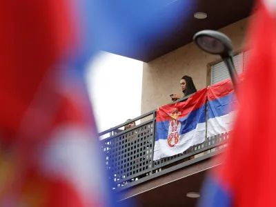 A Serbian flag is displayed on the balcony following local Serbs' decision to leave Kosovo institutions, in North Mitrovica, Kosovo, November 6, 2022. REUTERS/Ognen Teofilovski   TPX IMAGES OF THE DAY