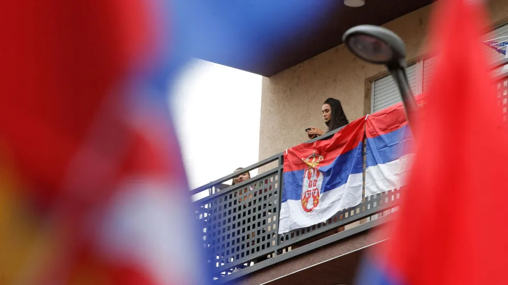 A Serbian flag is displayed on the balcony following local Serbs' decision to leave Kosovo institutions, in North Mitrovica, Kosovo, November 6, 2022. REUTERS/Ognen Teofilovski   TPX IMAGES OF THE DAY