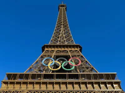 10 July 2024, France, Paris: The Eiffel Tower harbors the OLYMPIC RINGS for the Paris 2024 Olympic Games. Photo: Mickael Chavet/ZUMA Press Wire/dpa