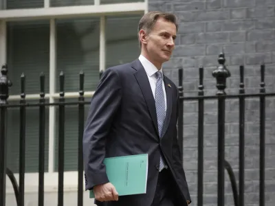 Britain's Chancellor Jeremy Hunt leaves 11 Downing Street to attend Parliament in London, Thursday, Nov. 17, 2022. Just three weeks after taking office, British Prime Minister Rishi Sunak faces the challenge of balancing the nation's budget while helping millions of people slammed by a cost-of-living crisis. Treasury chief Jeremy Hunt will deliver the government's plan for tackling a sputtering economy in a speech to the House of Commons on Thursday. (AP Photo/Kin Cheung)