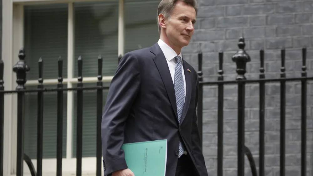 Britain's Chancellor Jeremy Hunt leaves 11 Downing Street to attend Parliament in London, Thursday, Nov. 17, 2022. Just three weeks after taking office, British Prime Minister Rishi Sunak faces the challenge of balancing the nation's budget while helping millions of people slammed by a cost-of-living crisis. Treasury chief Jeremy Hunt will deliver the government's plan for tackling a sputtering economy in a speech to the House of Commons on Thursday. (AP Photo/Kin Cheung)