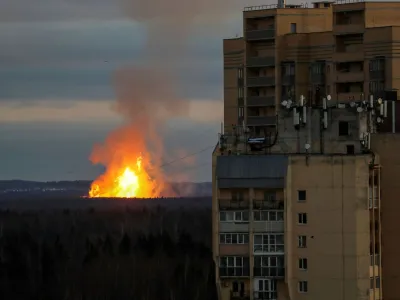 A view shows a fire behind a residential building located in Novoye Devyatkino settlement following a reported explosion of a gas pipe line in the Leningrad region, Russia, November 19, 2022. REUTERS/Stringer   TPX IMAGES OF THE DAY