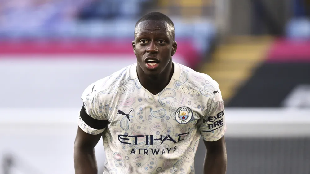 ﻿FILE - In this file photo dated Saturday, April 3, 2021, Manchester City's Benjamin Mendy during the English Premier League soccer match against Leicester City at the King Power Stadium in Leicester, England. Mendy will go on trial in January accused of raping two women and sexually assaulting a third alleged victim. He spoke only to confirm his name during a 45-minute hearing at a court in Chester in northwest England on Friday, Sept. 10. (AP Photo/Rui Vieira, FILE)