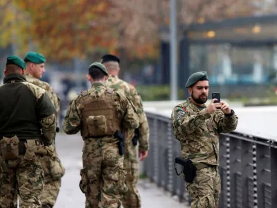 Hungarian soldiers belonging to NATO's peacekeeping mission KFOR walk on a bridge connecting north with south of Mitrovica, Kosovo, November 22, 2022. REUTERS/Ognen Teofilovski