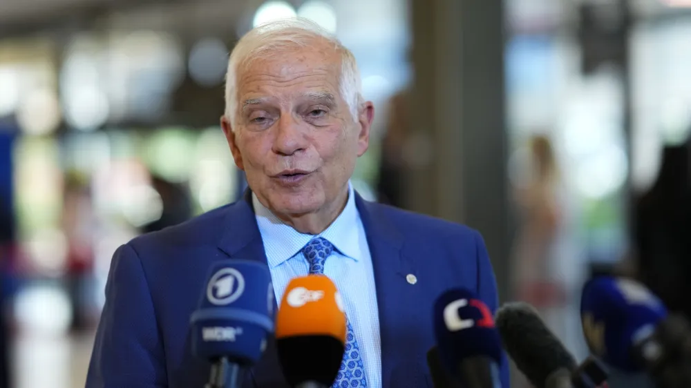 European Union foreign policy chief Josep Borrell speaks with the media as he arrives for a meeting of EU Foreign Ministers at the Prague Congress Center in Prague, Czech Republic, Tuesday, Aug. 30, 2022. (AP Photo/Petr David Josek)