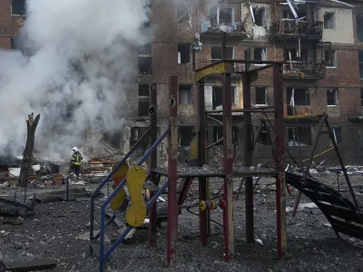 Ukrainian State Emergency Service firefighters work to extinguish a fire at the scene of a Russian shelling in the town of Vyshgorod outside the capital Kyiv, Ukraine, Wednesday, Nov. 23, 2022. Authorities reported power outages in multiple cities of Ukraine, including parts of Kyiv, and in neighboring Moldova after renewed strikes Wednesday struck Ukrainian infrastructure facilities. (AP Photo/Efrem Lukatsky)