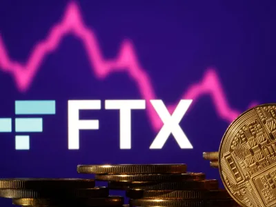 FILE PHOTO: Representations of cryptocurrencies are seen in front of displayed FTX logo and decreasing stock graph in this illustration taken November 10, 2022. REUTERS/Dado Ruvic/Illustration/File Photo