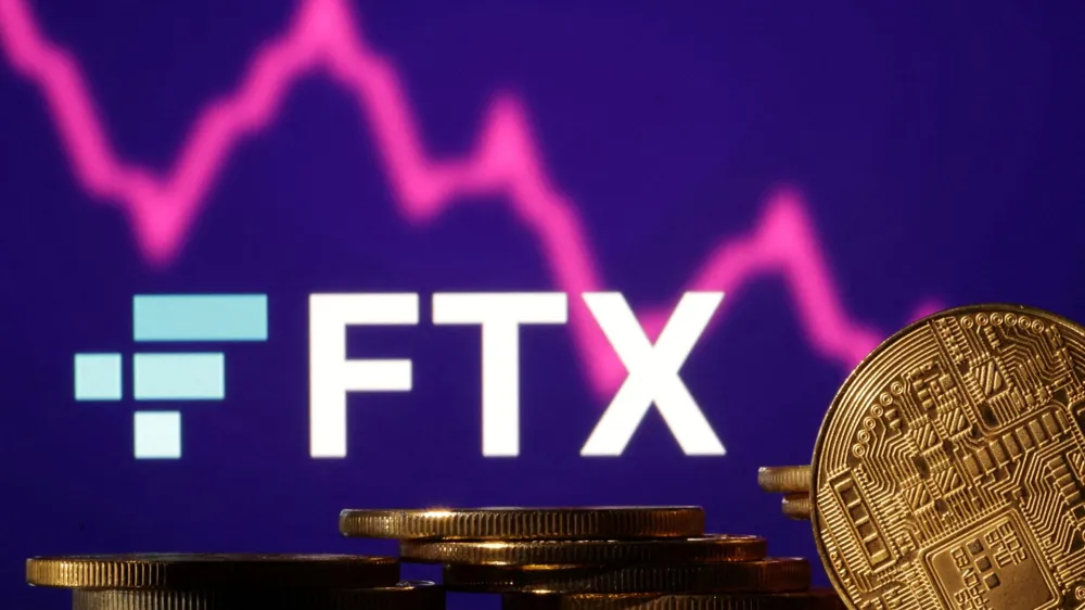 FILE PHOTO: Representations of cryptocurrencies are seen in front of displayed FTX logo and decreasing stock graph in this illustration taken November 10, 2022. REUTERS/Dado Ruvic/Illustration/File Photo