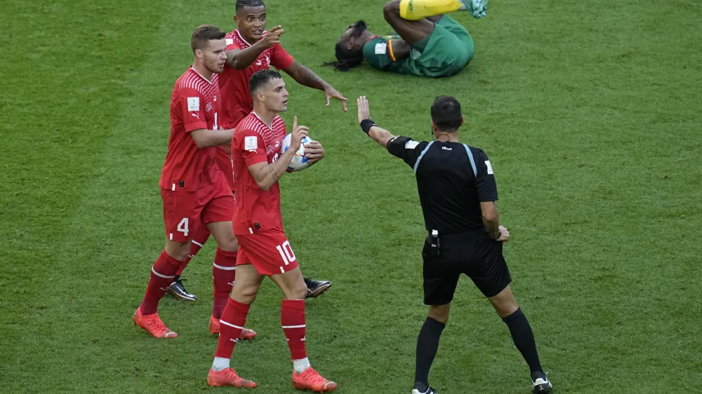 Swiss players complain on handball during the World Cup group G soccer match between Switzerland and Cameroon, at the Al Janoub Stadium in Al Wakrah, Qatar, Thursday, Nov. 24, 2022. (AP Photo/Ebrahim Noroozi)