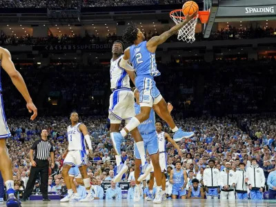 Apr 2, 2022; New Orleans, LA, USA; North Carolina Tar Heels guard Caleb Love (2) shoots the ball against Duke Blue Devils center Mark Williams (15) during the second half during the 2022 NCAA men's basketball tournament Final Four semifinals at Caesars Superdome. Mandatory Credit: Bob Donnan-USA TODAY Sports