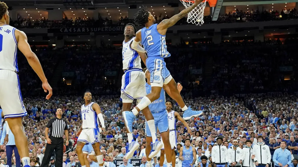 Apr 2, 2022; New Orleans, LA, USA; North Carolina Tar Heels guard Caleb Love (2) shoots the ball against Duke Blue Devils center Mark Williams (15) during the second half during the 2022 NCAA men's basketball tournament Final Four semifinals at Caesars Superdome. Mandatory Credit: Bob Donnan-USA TODAY Sports