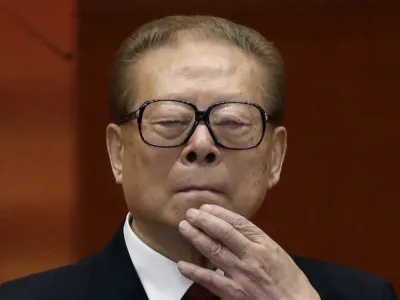 FILE - Former Chinese President Jiang Zemin watches the proceedings at the opening session of the 18th Communist Party Congress held at the Great Hall of the People in Beijing, Nov. 8, 2012. Jiang has died Wednesday, Nov. 30, 2022, at age 96. (AP Photo/Ng Han Guan, File)