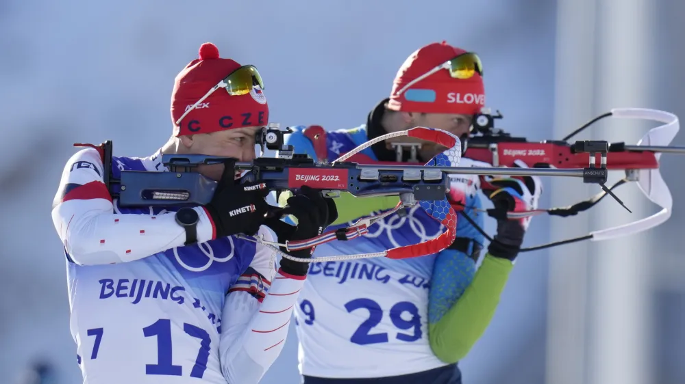 ﻿Jakub Stvrtecky of the Czech Republics (17) and Jakov Fak of Slovenia shoot during the men's 20-kilometer individual race at the 2022 Winter Olympics, Tuesday, Feb. 8, 2022, in Zhangjiakou, China. (AP Photo/Kirsty Wigglesworth)