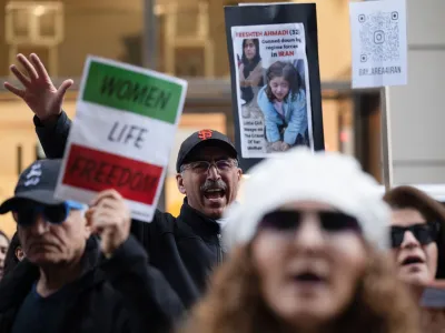 A man shouts out chants during a protest against gender-based violence in Iran, in front of the United Nations Children's Fund (UNICEF) office in San Francisco, California, U.S., November 30, 2022. REUTERS/Amy Osborne