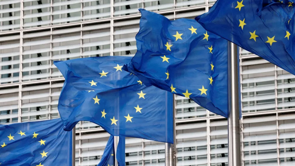 FILE PHOTO: European Union flags flutter outside the EU Commission headquarters in Brussels, Belgium, September 28, 2022. REUTERS/Yves Herman//File Photo