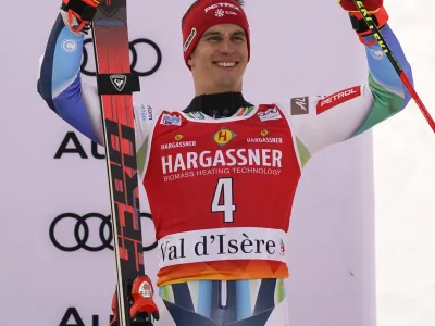 Slovenia's Zan Kranjec celebrates taking third place in an alpine ski, men's World Cup giant slalom, in Val D'Isere, France, Saturday, Dec.10, 2022. (AP Photo/Giovanni Auletta)