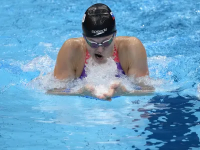 ﻿Katja Fain, of Slovenia, swims in a heat for the women's 400-meter Individual medley at the 2020 Summer Olympics, Saturday, July 24, 2021, in Tokyo, Japan. (AP Photo/Charlie Riedel)