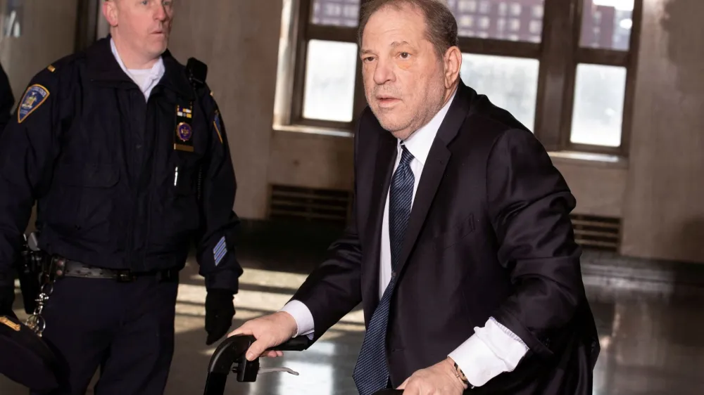 FILE PHOTO: Harvey Weinstein arrives at New York Criminal Court as the jury continues to deliberate in his sexual assault trial in the Manhattan borough of New York City, New York, U.S., February 21, 2020. REUTERS/Lucas Jackson/File Photo