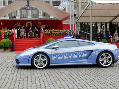 ﻿A Lamborghini car of the Italian Police passes in front of the Royal tribune during a military parade in front of the Royal Palace in Brussels, Wednesday July 21, 2010, for Belgium's National Day. (AP Photo/Thierry Charlier)