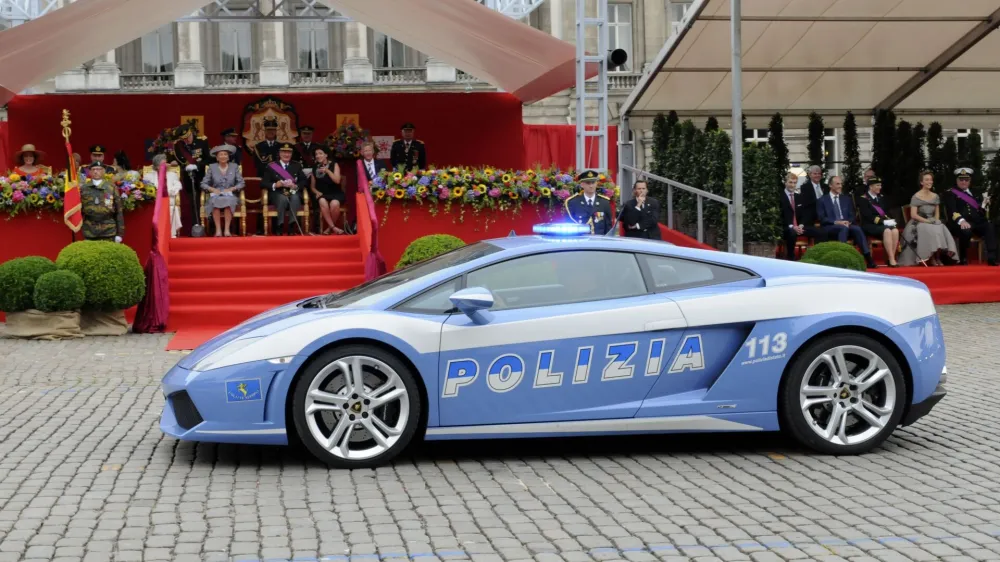 ﻿A Lamborghini car of the Italian Police passes in front of the Royal tribune during a military parade in front of the Royal Palace in Brussels, Wednesday July 21, 2010, for Belgium's National Day. (AP Photo/Thierry Charlier)