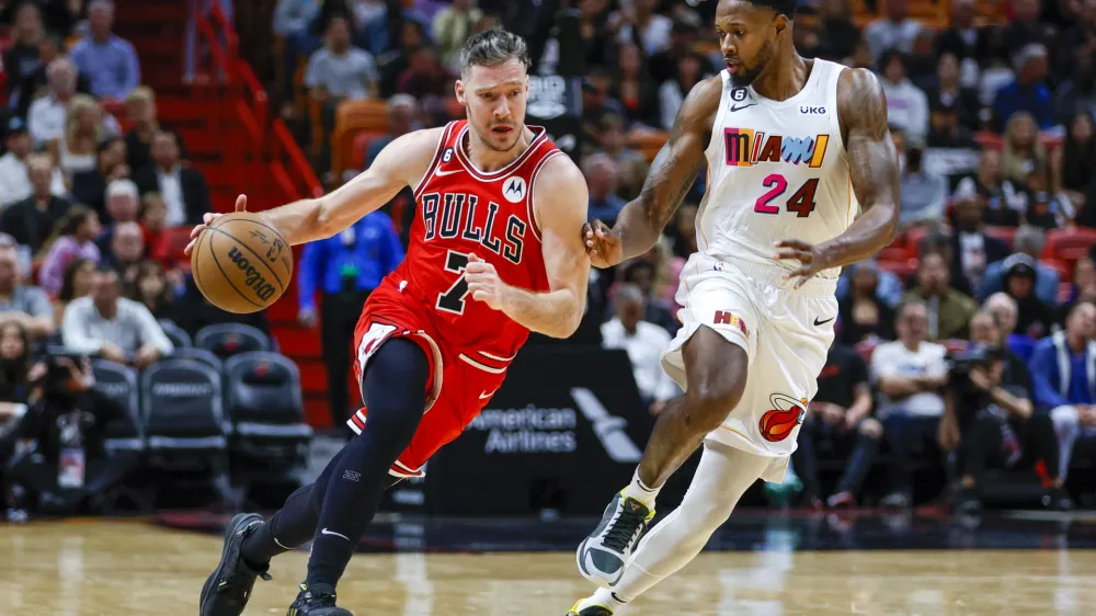 Dec 20, 2022; Miami, Florida, USA; Chicago Bulls guard Goran Dragic (7) dribbles the basketball as Miami Heat forward Haywood Highsmith (24) defends during the second quarter at FTX Arena. Mandatory Credit: Sam Navarro-USA TODAY Sports