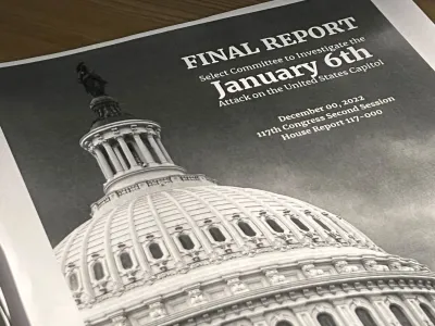 A copy of the printed final report by the congressional panel probing the Jan. 6, 2021 attack on the U.S. Capitol, outlining its case that former U.S. President Donald Trump should face criminal charges of inciting the deadly riot, is seen in a photo illustration in Washington, U.S. December 23, 2022. REUTERS/Julio-Cesar Chavez