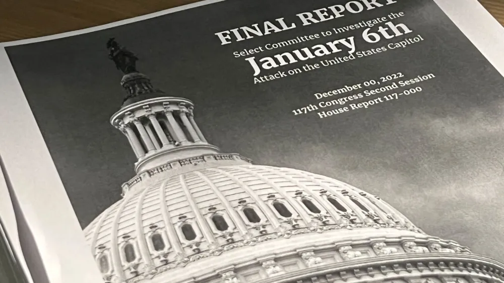 A copy of the printed final report by the congressional panel probing the Jan. 6, 2021 attack on the U.S. Capitol, outlining its case that former U.S. President Donald Trump should face criminal charges of inciting the deadly riot, is seen in a photo illustration in Washington, U.S. December 23, 2022. REUTERS/Julio-Cesar Chavez