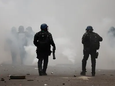 A Gendarmerie officer holds an LBD (defensive ball launcher) weapon, as members of the Kurdish community attend a demonstration, following a shooting, in Paris, France December 24, 2022. REUTERS/Sarah Meyssonnier