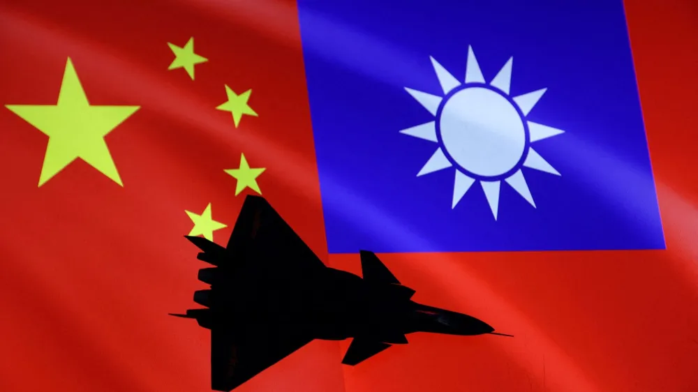 FILE PHOTO: Airplane is seen in front of Chinese and Taiwanese flags in this illustration, August 6, 2022. REUTERS/Dado Ruvic/Illustration/File Photo