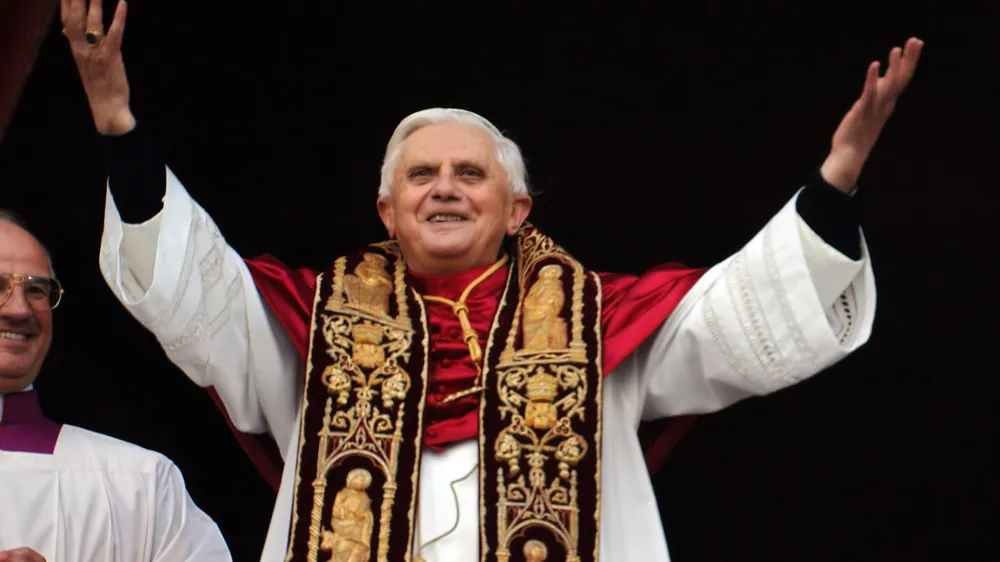 Pope Benedict XVI greets the crowd from the central balcony of St. Peter's Basilica at the Vatican, Tuesday, April 19, 2005. Joseph Ratzinger of Germany, who chose the name of Pope Benedict XVI, is the 265th pontiff of the Roman Catholic Church. (AP Photo/Domenico Stinellis)