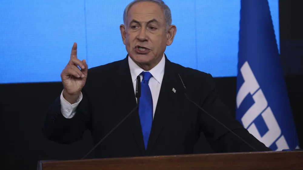 FILE - Benjamin Netanyahu, former Israeli Prime Minister and the head of Likud party, speaks to his supporters after first exit poll results for the Israeli Parliamentary election at his party's headquarters in Jerusalem on Nov. 2, 2022. Netanyahu's Likud party released the new government's policy guidelines on Wednesday, Dec. 28, 2022. Netanyahu's incoming hard-line government has put West Bank settlement expansion at the top of its list of priorities a day before it's set to be sworn into office. (AP Photo/Oren Ziv, File)