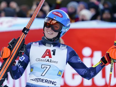 United States' Mikaela Shiffrin celebrates winning an alpine ski, women's World Cup giant slalom, in Semmering, Austria, Wednesday, Dec.28, 2022. (AP Photo/Piermarco Tacca)