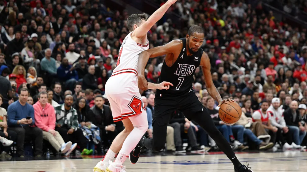 Jan 4, 2023; Chicago, Illinois, USA; Brooklyn Nets forward Kevin Durant (7) drives in the second half against Chicago Bulls guard Goran Dragic (7) at United Center. Mandatory Credit: Quinn Harris-USA TODAY Sports