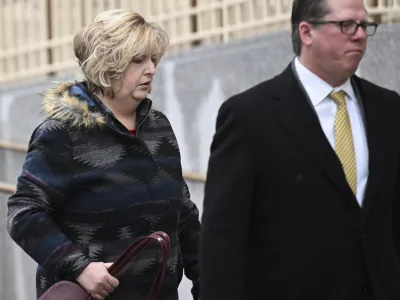 Megan Hess, left, arrives to the Wayne Aspinall Courthouse with her attorney for her and her mother's Shirley Koch sentencing trial on Tuesday, Jan. 3, 2023 in Grand Junction, Colo. Hess, a funeral home operator accused of illegally selling body parts and giving clients fake ashes was sentenced to 20 years in prison Tuesday by a federal court judge. U.S. authorities say that on dozens of occasions Hess and her mother, Shirley Koch, transferred bodies or body parts to third parties for research without families' knowledge.  (RJ Sangosti/The Denver Post via AP)